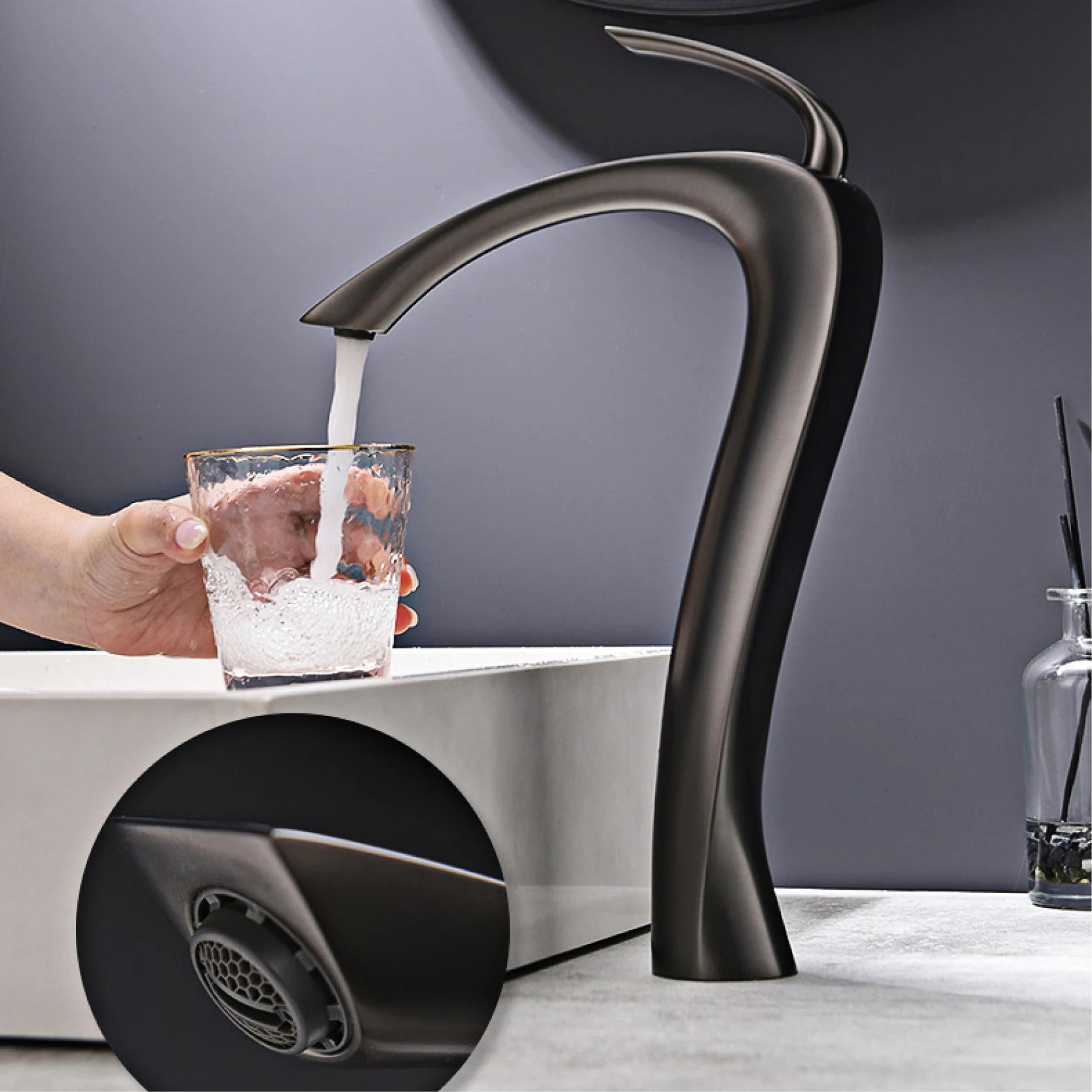 Black faucet pouring water into a glass on a modern kitchen sink.