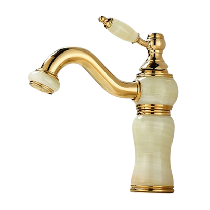 Gold and beige faucet on a white background