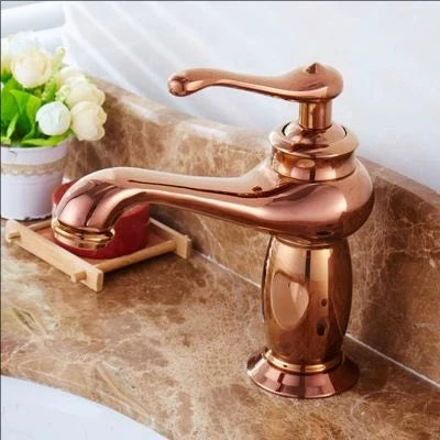 Rose gold faucet on a marble countertop with a white background