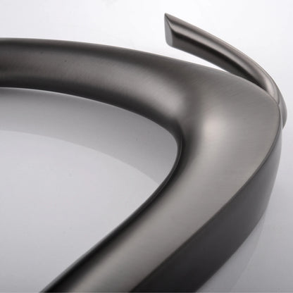 Close-up of a metallic car bumper on a white background
