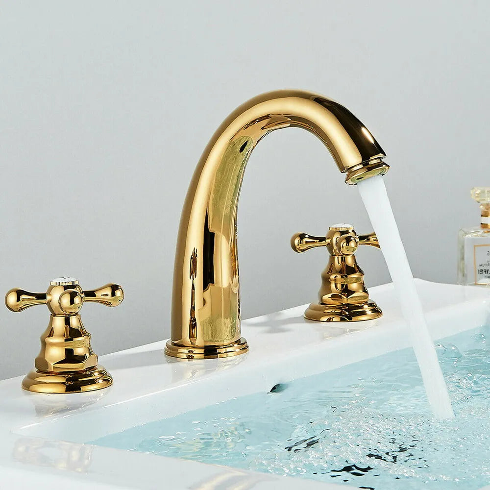 Gold faucet with water flowing into a sink on a light gray background