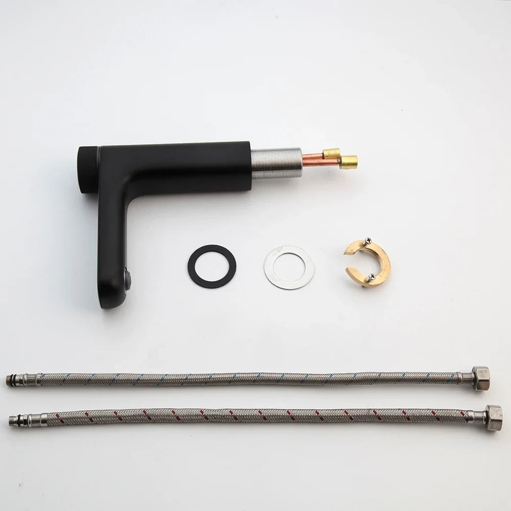 Presta valve tool kit with black handle, hose, and small components on a white background