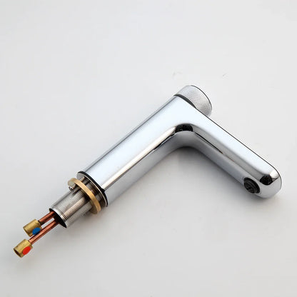 Chrome faucet handle with internal components on a white background