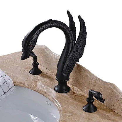 Decorative black faucet with intricate design on a bathroom sink.