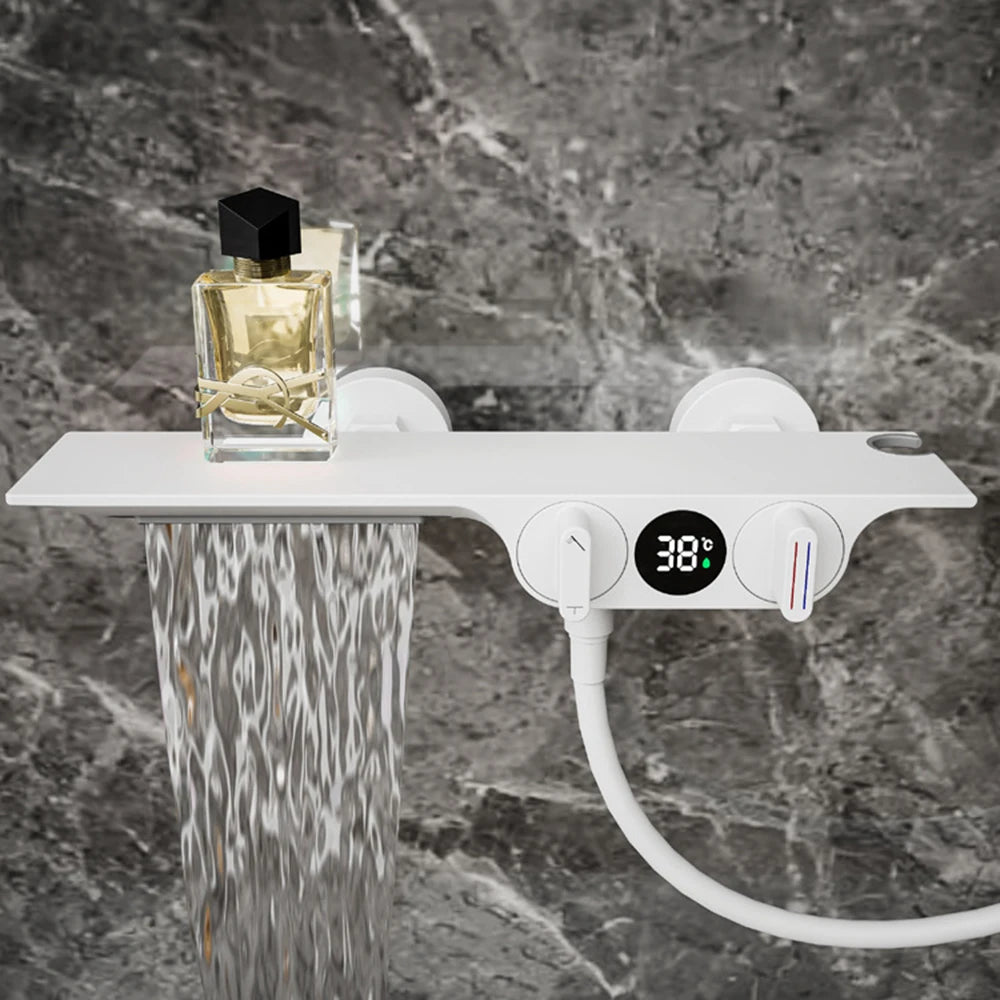 Digital shower control panel with temperature display on a marble wall background
