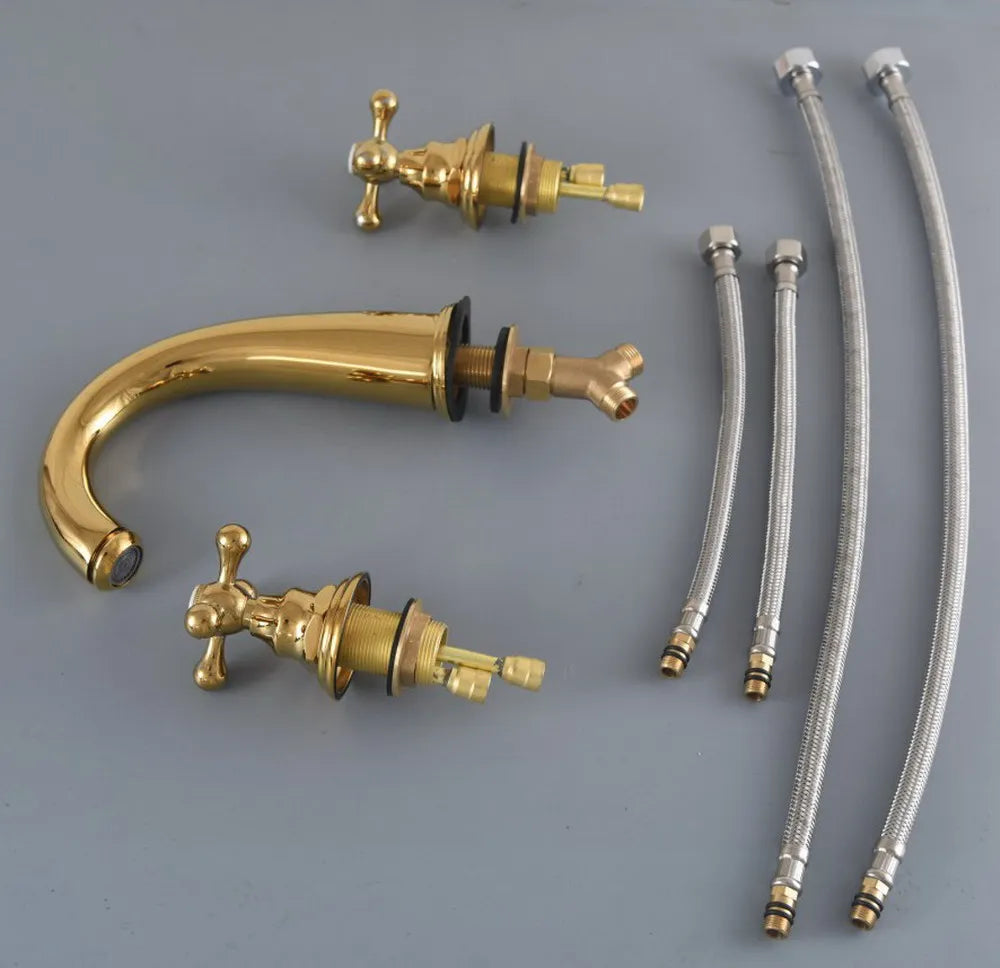 Set of gold faucets and metallic hoses on a gray background